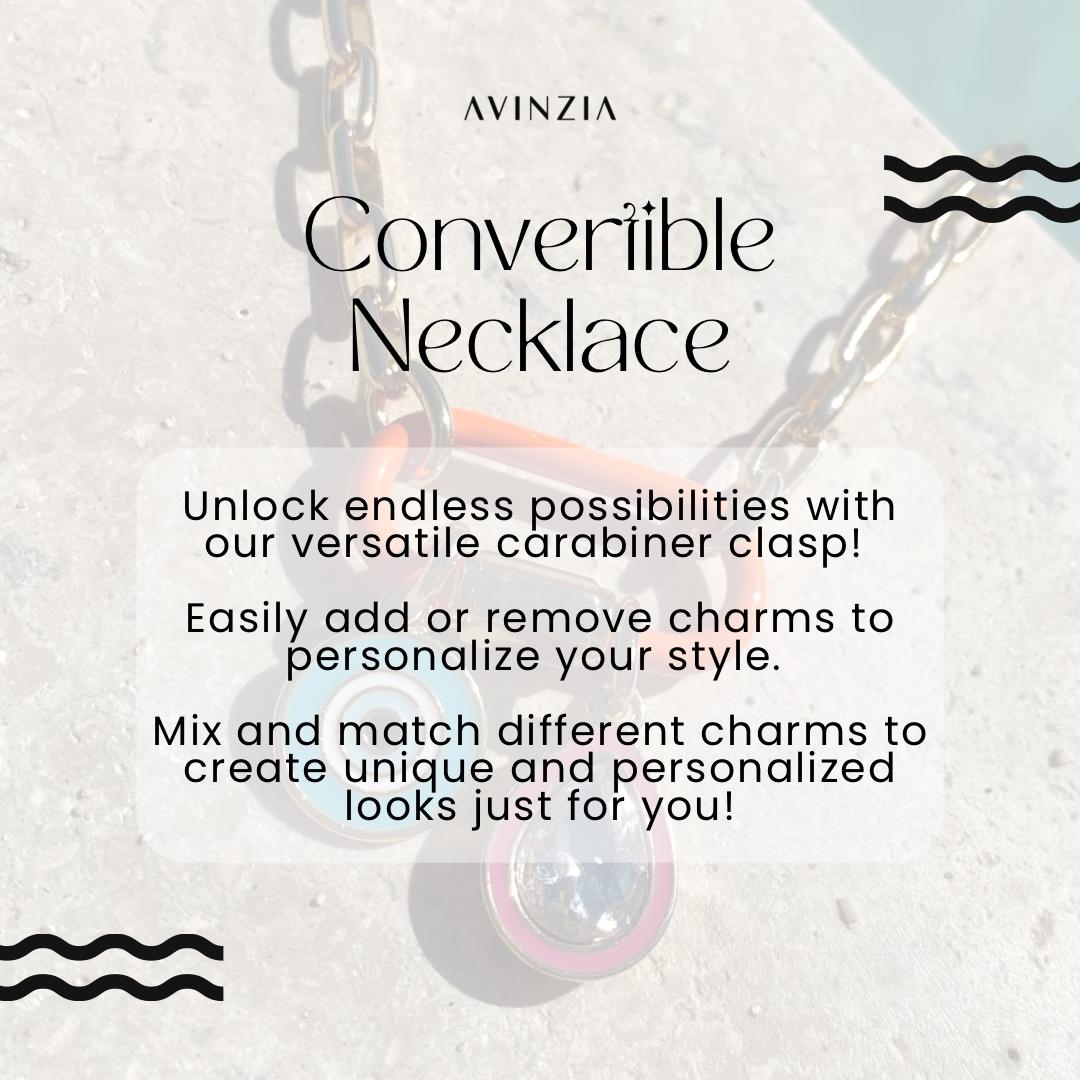 May include: A silver chain necklace with a carabiner clasp. The necklace is decorated with colorful charms, including a blue and white evil eye charm. The text on the image reads 'AVINZIA', 'Convertible Necklace', 'Unlock endless possibilities with our versatile carabiner clasp!', 'Easily add or remove charms to personalize your style.', 'Mix and match different charms to create unique and personalized looks just for you!'