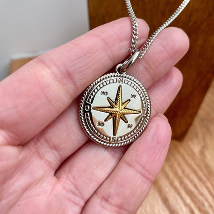 Mixed metal compass necklace on a Cuban chain