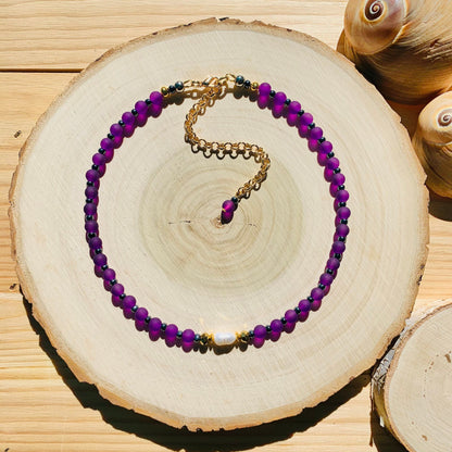 Multicolor beaded necklace worn with a summer outfit