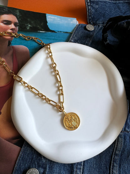 Gold Benedict coin necklace worn as a layered set