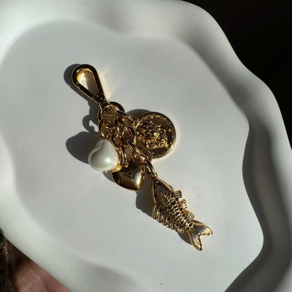 Lion and fish gold bag charm and keychain purse accessory — AVINZIA handmade jewelry