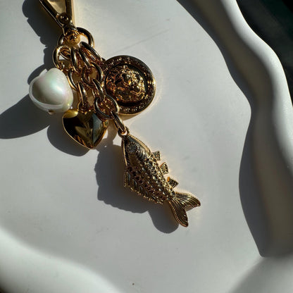 Lion and fish gold bag charm and keychain purse accessory by AVINZIA