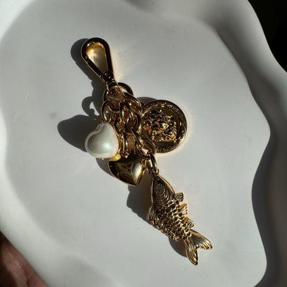Lion and fish gold bag charm and keychain purse accessory — handmade in Florida by AVINZIA