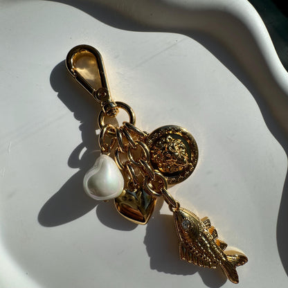 Lion and fish gold bag charm and keychain purse accessory — gift-ready handmade jewelry by AVINZIA