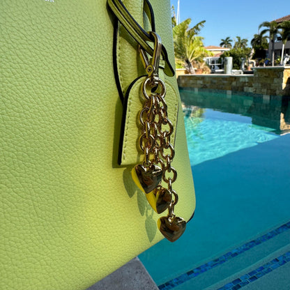 Waterfall keychain with three gold puffy heart charms for bags by AVINZIA — handmade coastal jewelry