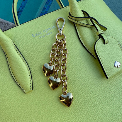 Waterfall keychain with three gold puffy heart charms for bags by AVINZIA