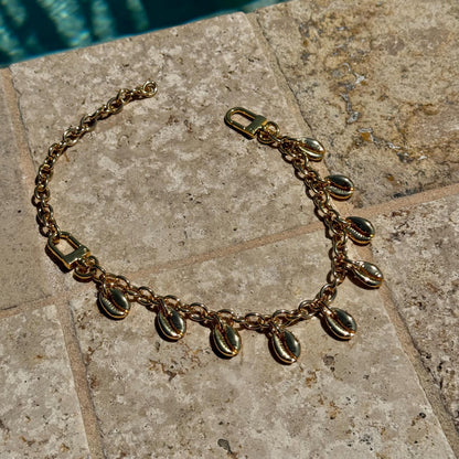 Cowrie shell purse chain and convertible necklace in gold by AVINZIA — handmade coastal jewelry
