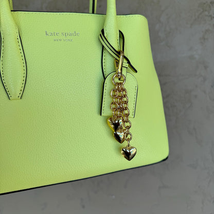 Waterfall keychain with three gold puffy heart charms for bags — handmade in Florida by AVINZIA