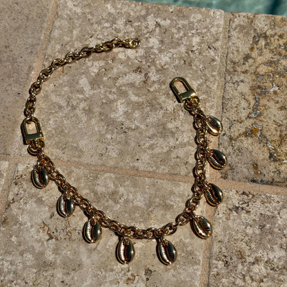Cowrie shell purse chain and convertible necklace in gold by AVINZIA