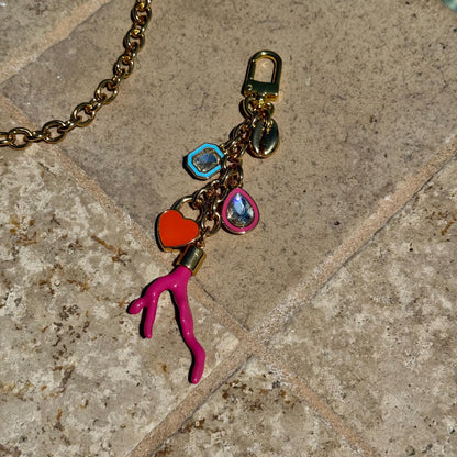 Cowrie shell gold purse chain and convertible necklace with clip charm by AVINZIA