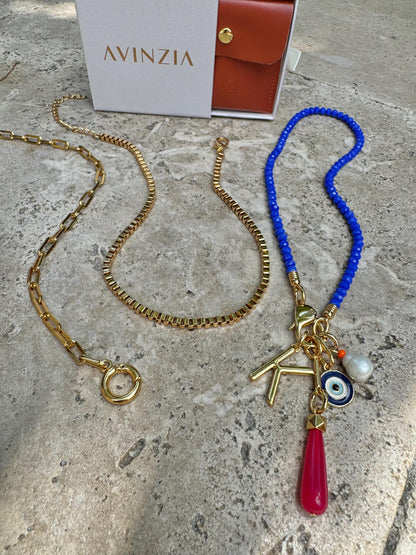 Royal blue beaded necklace with gold chain stack options — handmade in Florida by AVINZIA
