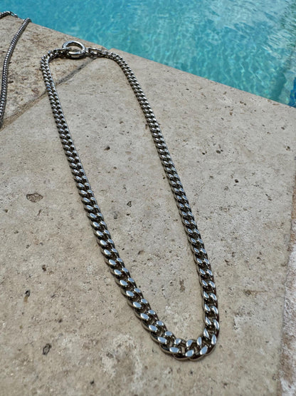 Mixed metal silver and gold necklace stack with charm chains — gift-ready handmade jewelry by AVINZIA