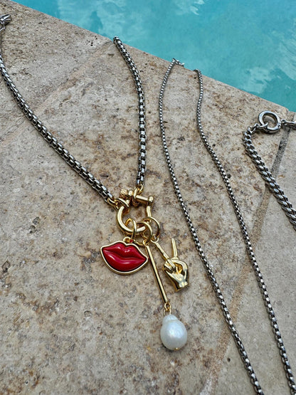 Mixed metal silver and gold necklace stack with charm chains by AVINZIA — handmade coastal jewelry