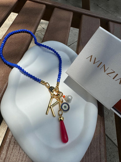 Royal blue beaded necklace with gold chain stack options — handmade in Florida by AVINZIA