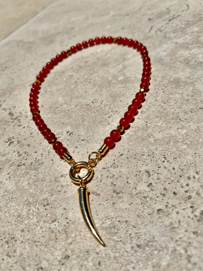 Carnelian beaded gemstone necklace with gold tooth charm by AVINZIA