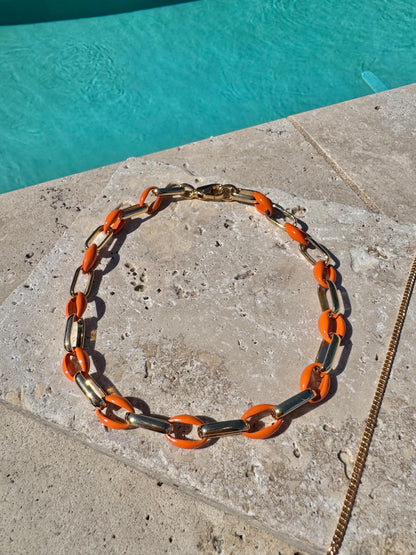 Gold tusk charm necklace with orange enamel choker option by AVINZIA