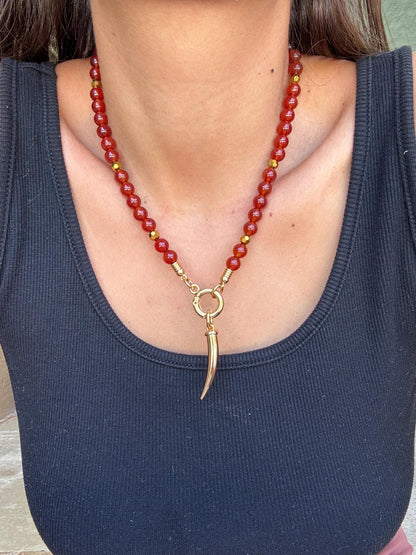 Carnelian beaded gemstone necklace with gold tooth charm by AVINZIA — handmade coastal jewelry