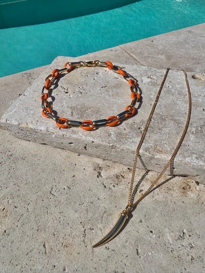 Gold tusk charm necklace with orange enamel choker option by AVINZIA