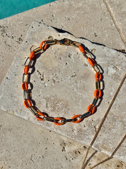 Gold tusk charm necklace with orange enamel choker option — AVINZIA handmade jewelry