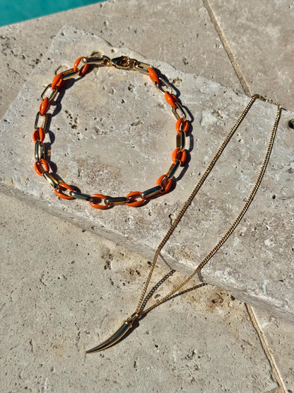 Gold tusk charm necklace with orange enamel choker option by AVINZIA — handmade coastal jewelry