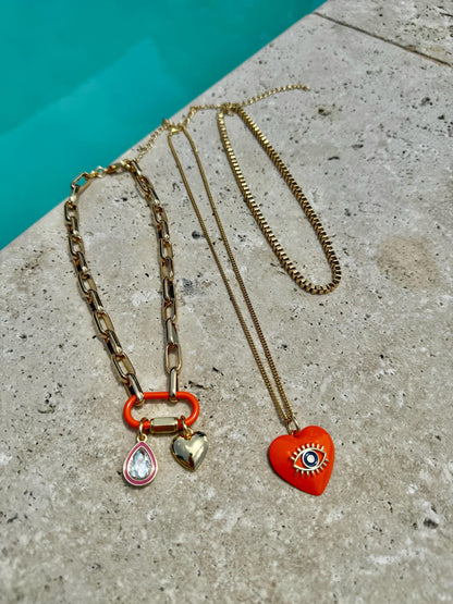Heart charm necklace set with orange evil eye chain option — handmade in Florida by AVINZIA