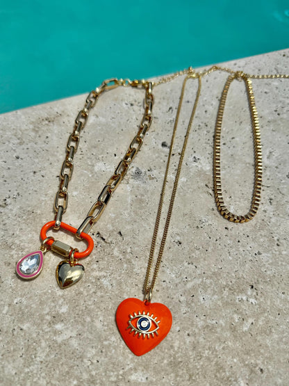 Heart charm necklace set with orange evil eye chain option by AVINZIA