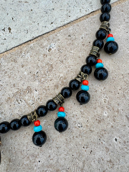 Black obsidian beaded necklace with crescent moon charm by AVINZIA — handmade coastal jewelry