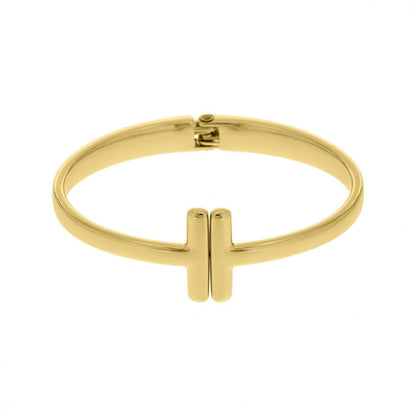 Simple gold bangle worn stacked